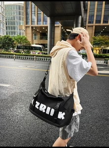 Close-up of durable black oxford fabric travel bag with white ZRIINK letter printing