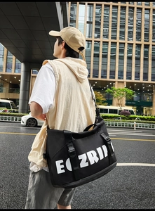 Detail of a black high-capacity oxford travel bag with bold EOZRIN letter printing