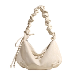 Cream pleated hobo bag in soft PU leather with bow details and scrunchie strap