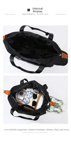 Internal view of a large black oxford travel bag showing high capacity storage for essentials