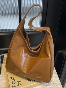 Large caramel tote bag in shiny crinkled PU leather with contrast stitching and fashion label