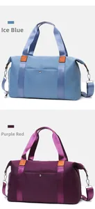 Large Oxford fabric travel bags in Iceberg Blue and Purplish Red with straps