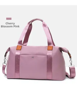Macro view of cherry blossom pink travel bag featuring waterproof fabric and side pocket