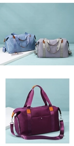 Detail view of large nylon travel bags in purple and blue with waterproof fabric texture