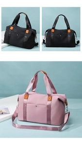Detail of oxford fabric travel bags in black and pink with durable reinforced handles