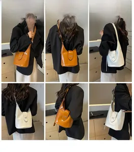 Detail shots of minimalist bucket bags with bow buckles in brown and white variants