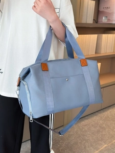 Light blue large capacity oxford travel bag with brown leather handles and side zip pocket