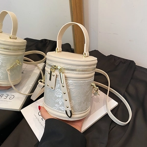 Chic beige jacquard bucket bag with floral patterns and gold hardware for women