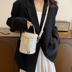 Elegant cream floral jacquard bucket bag with top handle and detachable strap