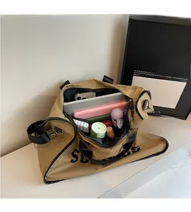 Interior view of khaki travel bag showing spacious storage for laptop and cosmetics