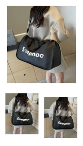 Macro detail of waterproof nylon travel bag showing Suepnoc letter print and strap