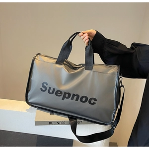 Close-up of gray travel fitness bag featuring Suepnoc logo and waterproof nylon fabric texture