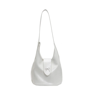 Chic white faux leather bucket bag featuring a silver bow buckle and long shoulder strap
