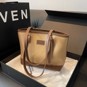 Detail of a vintage tote bag with adjustable leather straps in a premium gift box