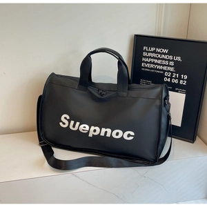 Close-up of black waterproof nylon travel bag with Suepnoc logo and dual handles