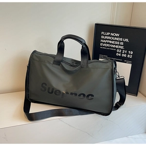 Close-up of waterproof fabric and Suepnoc logo on large travel duffel bag