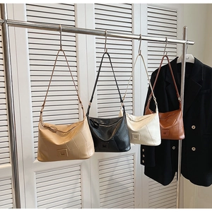 Detailed display of four PU leather crossbody bags in khaki, black, cream, and brown