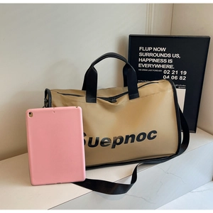 Close-up of khaki waterproof nylon travel bag with Suepnoc logo and black straps