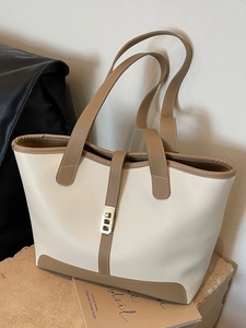 Minimalist beige and brown tote bag with gold metal buckle for daily commute