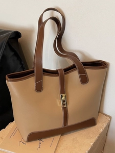 Large khaki patchwork tote bag with brown straps and elegant gold metal buckle detail
