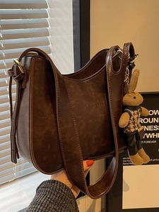 Retro deep brown large capacity bucket bag in vintage faux leather with a cute rabbit charm