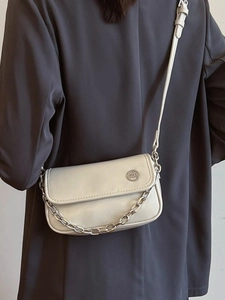 Chic beige crossbody square bag with a metallic logo and thick gold chain strap