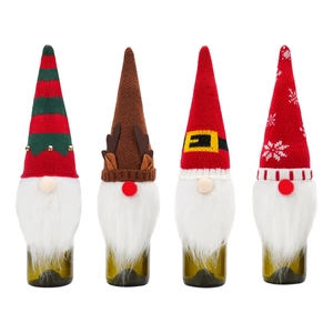 Set of four festive Christmas gnome wine bottle covers with colorful knitted hats and faux beards