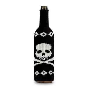 Detail of knitted Halloween wine bottle cover with skull pattern and geometric design