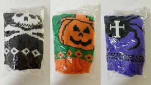 Three-piece knitted Halloween wine bottle covers with skull and pumpkin patterns