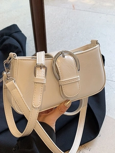 Ivory white shoulder bag with silver round buckle and adjustable strap for women