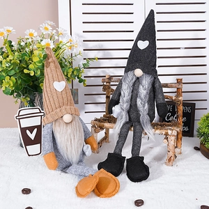 Gnome plush coffee figurines with knitted hats and coffee bean decor on a fur mat