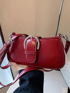 Vintage wine red shoulder bag in glossy leather with oversized silver buckle detail