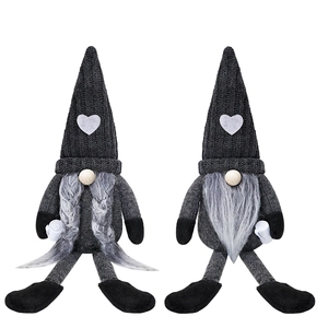 Close-up of heart-patterned knitted hats and plush textures on coffee gnome dolls