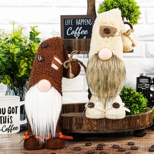 Set of two coffee-themed plush gnomes with coffee bean accents on a wooden tray
