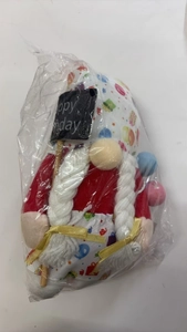 Detailed view of a plush birthday gnome with Happy Birthday sign and colorful balloons
