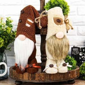 Set of two coffee theme gnomes with plush hats and bean details on wooden tray