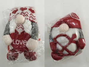 Detail of Valentine Gnomes in plastic packaging with Love heart and knitted hats