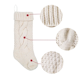 Cable knit white Christmas stocking with hanging loop for holiday fireplace decorations