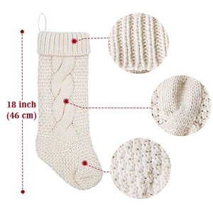 Close-up of 18 inch cream knitted Christmas stocking showing thick cable knit texture