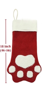 Détail d'une chaussette de Noël en tricot rouge et blanc de 46 cm avec motif de patte d'animal