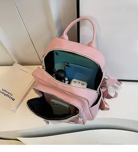 Pink lychee grain leather backpack with internal storage for tablets and gadgets