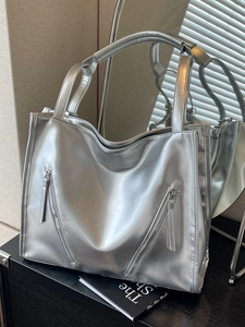 Metallic silver large tote bag with double front zippers and glossy mirror finish
