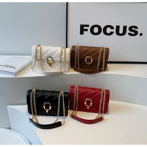 Detail of four colorful quilted crossbody bags with gold chain straps and metal buckles