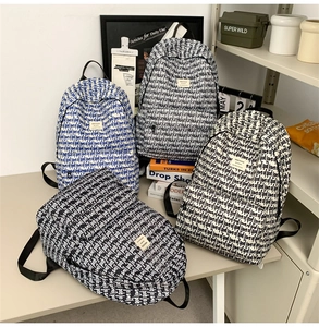 Detailed view of large capacity backpacks with love of god pattern for school and travel
