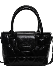 Fashionable black quilted bucket bag with top handles and stylish triangle stitching