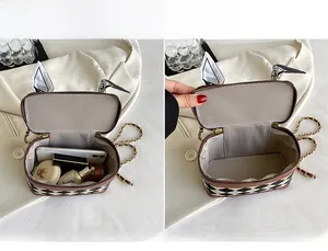 Detail view of the spacious quilted crossbody bag interior holding daily essentials