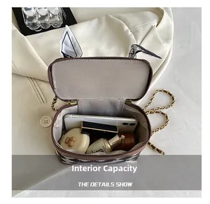 Detail view of large interior capacity for chain crossbody bag with tweed and leather