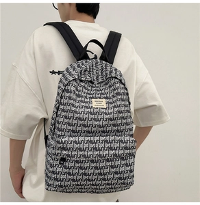 Detailed back view of a high-capacity school backpack with stylish black and white pattern