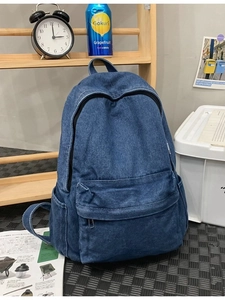 Large capacity dark blue denim backpack with front pocket and retro canvas texture