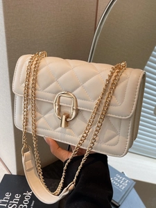 Chic cream quilted crossbody bag with gold chain strap and elegant metal clasp